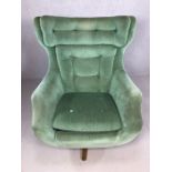 Mid Century retro swivel button backed armchair on wooden base