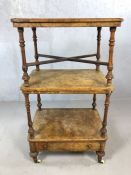 Burr walnut two tier tea trolley with single drawer, on castors along with a burr walnut low