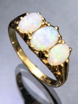9ct Gold three stone Opal ring.(approx 7mm across). Bright colourful Opals in ornate setting, rig