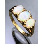 9ct Gold three stone Opal ring.(approx 7mm across). Bright colourful Opals in ornate setting, rig