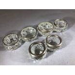 Three pairs of Silver collared and glass salts