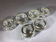 Three pairs of Silver collared and glass salts