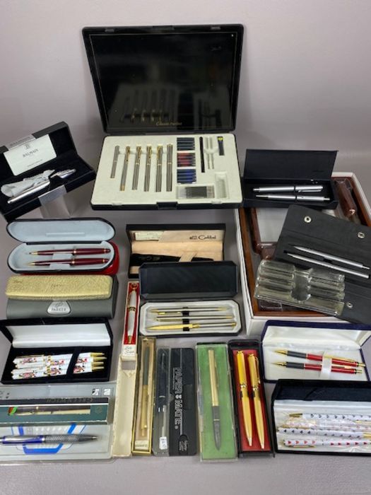 Large collection of mostly boxed fountain and ball pens to include Colibri, Paper Mate, Dunes,