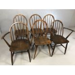 Six Ercol stick back chairs, to include two carvers