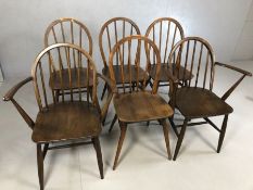 Six Ercol stick back chairs, to include two carvers