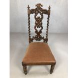 Heavily carved antique chair with hearts splat design