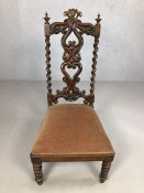 Heavily carved antique chair with hearts splat design