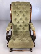 Antique x-frame large armchair with turned cross-stretchers and green button back upholstery, approx