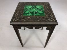 Arts and Craft small heavily carved side table with inlaid green ceramic glazed tile, approx 30cm