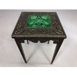 Arts and Craft small heavily carved side table with inlaid green ceramic glazed tile, approx 30cm