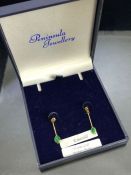 Pair of 9ct Gold drop earrings set with Emeralds each approx 25mm in length