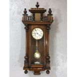 Vienna wall clock with white ceramic dial and pendulum, key, and ornate gallery