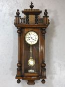 Vienna wall clock with white ceramic dial and pendulum, key, and ornate gallery