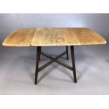 Oak drop leaf table with cross stretcher