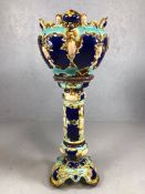 Victorian Majolica jardiniere and stand, with moulded decoration on a blue ground, marked '8' to