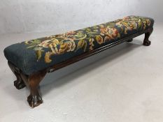 Antique wooden framed, upholstered kneeler on ball and caw carved feet, approx 105cm x 22cm x 22cm