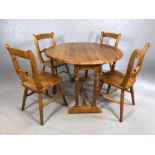 Pine drop leaf gate leg table with four matching pine chairs