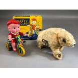 Vintage Toys: tinplate and plastic clockwork toy 'The Happy Cyclist' (A/F), in original box, and a