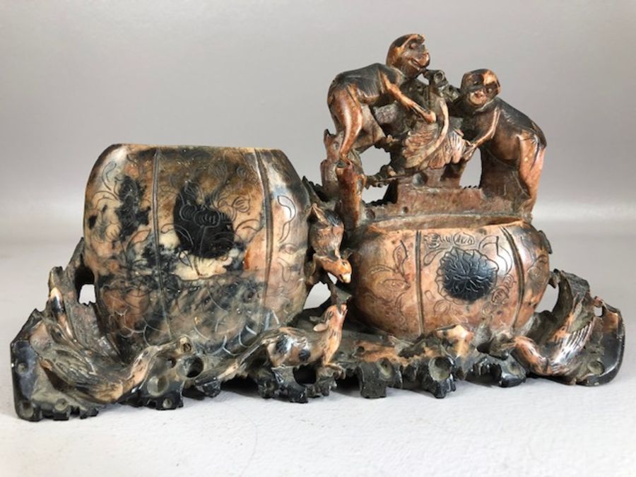 Chinese carved soapstone brush pot with intricately carved monkeys, rats and birds, approx 22cm in