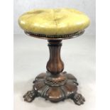 Heavily carved ornate stool on three large lion paw feet, with leather button seat, approx 50cm