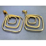 Pair of large 9ct Gold earrings of sets of three graduating Gold squares (dent to one) approx 38mm
