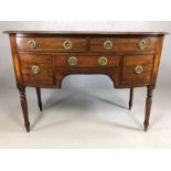 Antique writing desk on turned legs with brass fitments to five drawers, approx 106cm x 52cm x