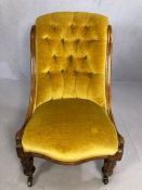 Antique bedroom chair in mustard fabric with button back on original castors, stands approx 85cm
