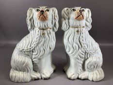 Pair of Staffordshire Spaniel Mantel Dogs, having gilt coloured collars and chains with yellow eyes,