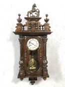 Vienna style eight day spring driven striking clock in mahogany case, circa 1880 - 1890, with