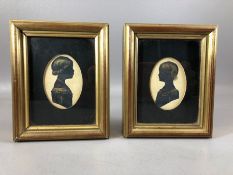 Pair of miniature portrait silhouettes of children in profile, approx 6.5cm in height, each in