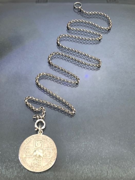 A British King George II 1745 silver half crown coin made into a pendant on a sterling silver chain