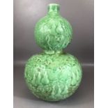 Chinese double gourd vase, monochrome green glaze, decorated in relief with foliate design with