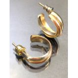 Pair of Gold earrings unmarked but tests as Gold, three colour twisted design approx 9.5g