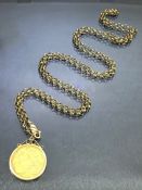 Half Sovereign dated 1909 in a 9ct Gold mount on a 9ct Gold hallmarked chain approx 74cm long and