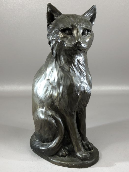 Heavy figure of a seated cat marked 'Sophie Connors'. approx 27cm in height