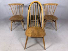 Four Ercol dining chairs, to include a pair of blond stick back chairs