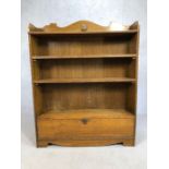 Arts and Crafts style oak bookcase with two adjustable shelves and cupboard under, approx 101cm x