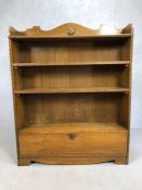 Arts and Crafts style oak bookcase with two adjustable shelves and cupboard under, approx 101cm x