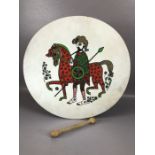 Welsh folk drum, approx 46cm in diameter, with a figure of a man and horse, with double ended