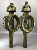 Pair of Brass Coaching oil lamps with red glass to reverse and ornate chimneys approx 45cm tall