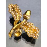 Gold Coloured brooch set with seed pearls in the form of a Acorn and two oak leaves approx 34mm x