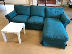 Modern L-shaped three seater sofa in green fabric, with a white coffee table, sofa approx 245cm x