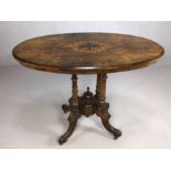 Antique oval occasional table on four turned supports and four splayed legs, the top with inlaid