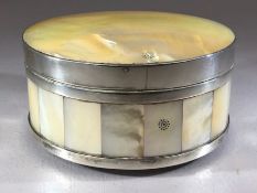 Mother of Pearl circular lidded box with Silver banding with Sun logo approx 12cm in diameter