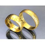 Two 22ct gold bands sizes 'T' & 'M' total weight approx 10.4g