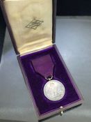 OBE Medal in original case by John Pinches London with Purple ribbon "FOR GOD AND THE EMPIRE"