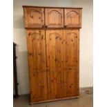 Pine triple door wardrobe with storage box above, approx 134cm x 53cm x 225cm tall