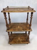 Three tier what-not with brass gallery, turned supports and fine inlay to each of the three shelves,