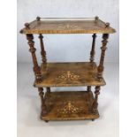 Three tier what-not with brass gallery, turned supports and fine inlay to each of the three shelves,