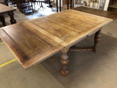 Pine extending dining table with cross stretcher on turned legs, un-extended approx 122cm x 107cm